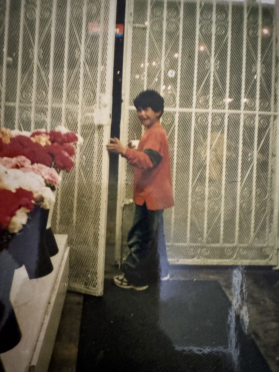 Boy closing the flower shop